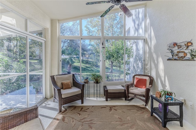 sunroom featuring ceiling fan and a healthy amount of sunlight