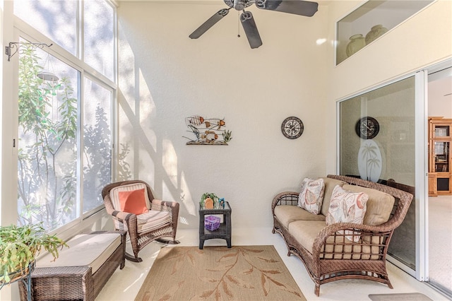 living area featuring ceiling fan