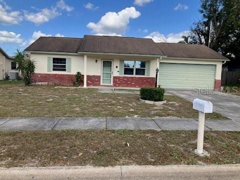 single story home featuring a garage