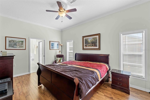 bedroom featuring connected bathroom, ceiling fan, light hardwood / wood-style flooring, a textured ceiling, and ornamental molding