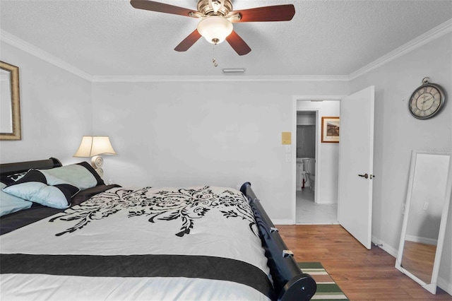 bedroom featuring hardwood / wood-style floors, ceiling fan, crown molding, and a textured ceiling