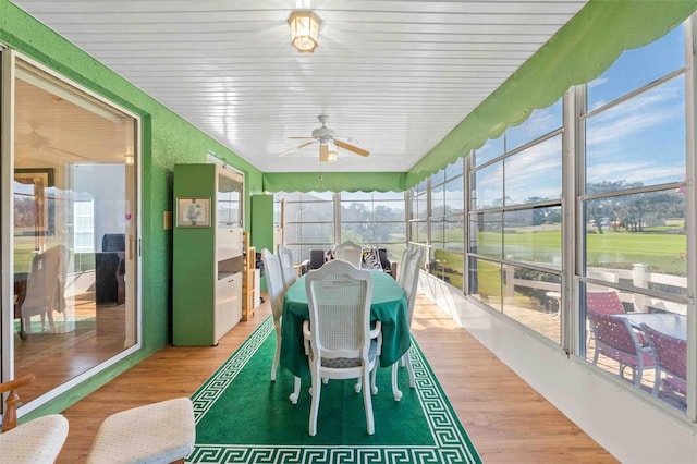 sunroom / solarium featuring ceiling fan