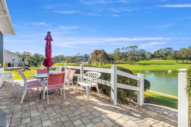 view of patio with a water view