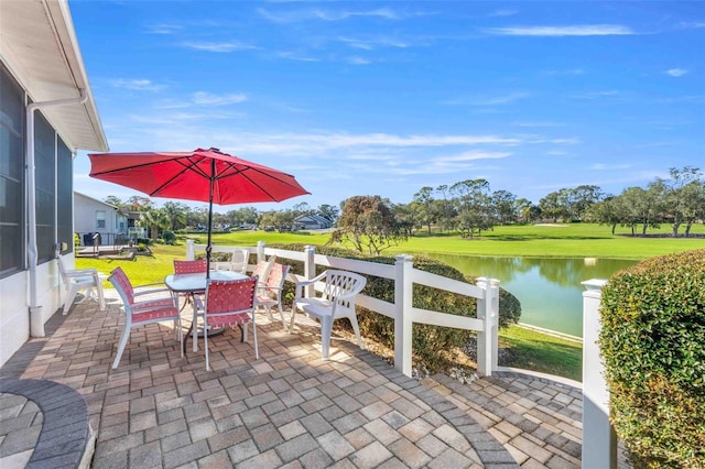 view of patio with a water view