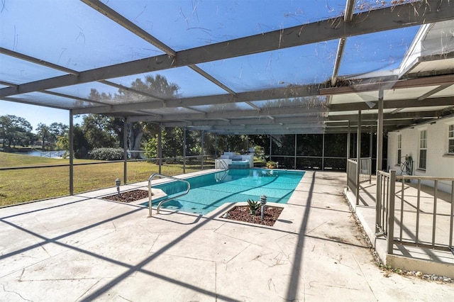 view of swimming pool featuring a patio area, a water view, and glass enclosure