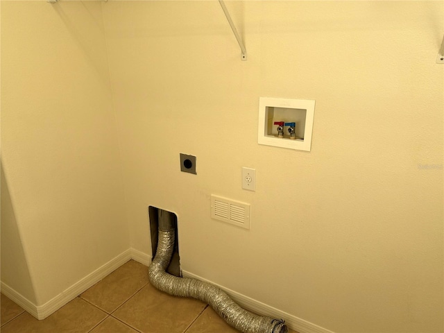 laundry room with light tile patterned floors, hookup for a washing machine, hookup for an electric dryer, laundry area, and baseboards