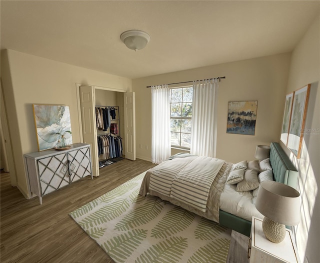 bedroom with a closet and wood finished floors