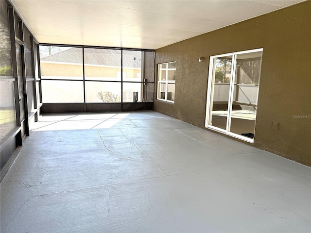 unfurnished sunroom with a wealth of natural light