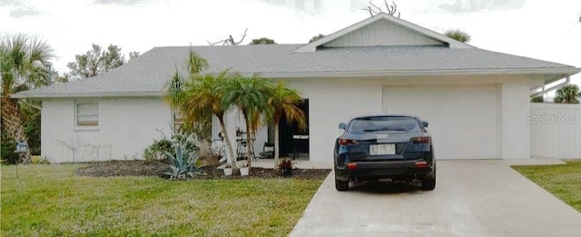 view of front of property with a garage and a front yard