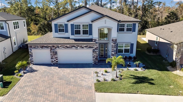 view of front property with a garage and a front lawn