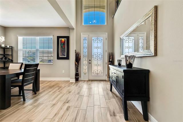 entryway with light hardwood / wood-style flooring