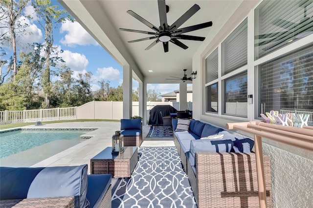 view of patio / terrace with a fenced in pool, grilling area, ceiling fan, and an outdoor hangout area