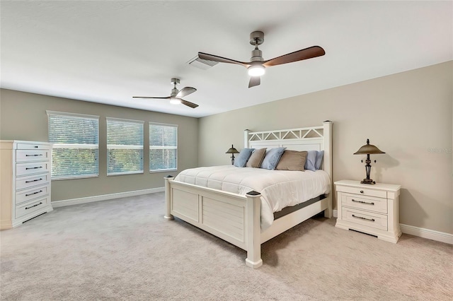 bedroom with ceiling fan and light colored carpet