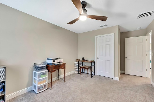 office area with light carpet and ceiling fan