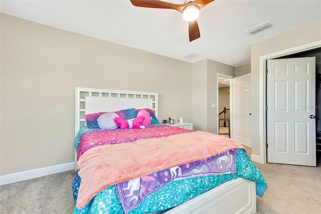 carpeted bedroom featuring ceiling fan