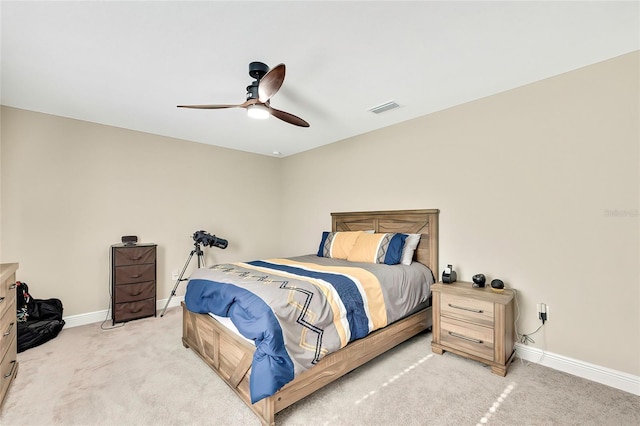 bedroom with ceiling fan and light colored carpet