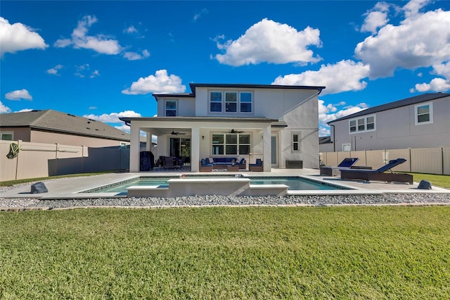 rear view of property featuring ceiling fan, a fenced in pool, an outdoor living space, and a patio