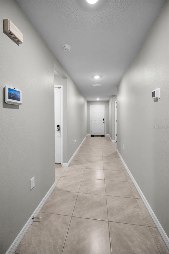 hallway with light tile patterned flooring