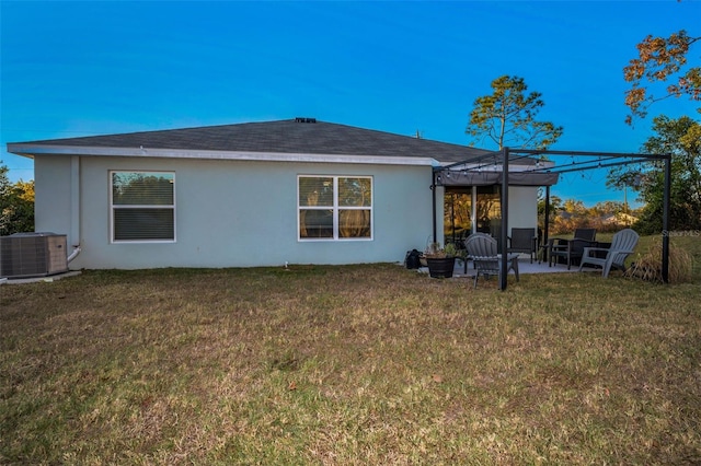 back of property with a yard, a pergola, a patio, and cooling unit