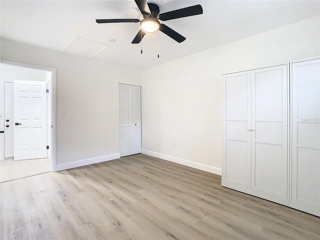 unfurnished bedroom with ceiling fan and light hardwood / wood-style floors