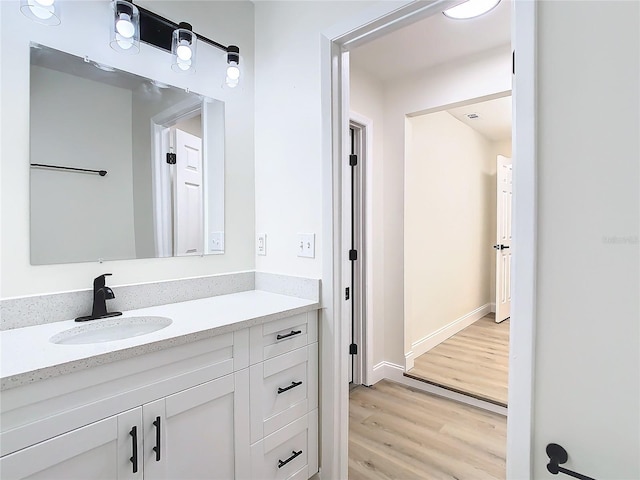 bathroom featuring hardwood / wood-style floors and vanity