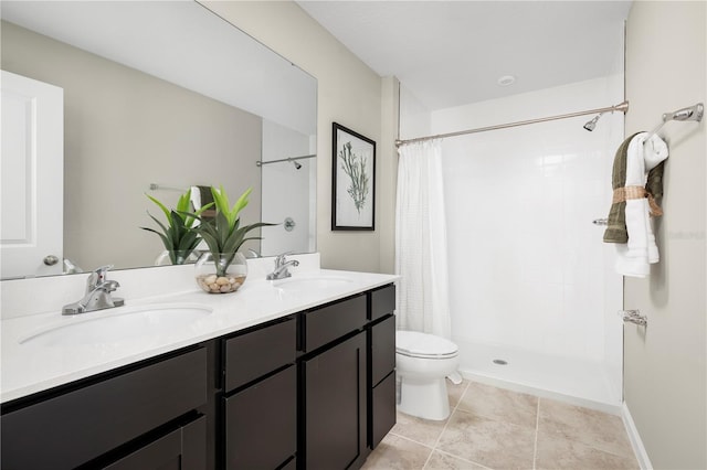 bathroom with tile patterned flooring, vanity, curtained shower, and toilet