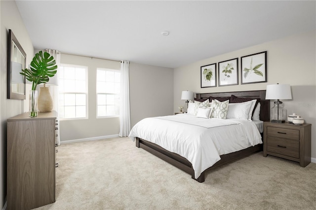 bedroom with light colored carpet