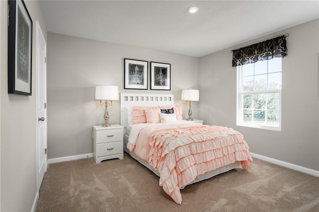 bedroom with light carpet