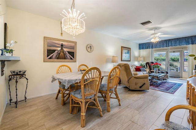 dining room with ceiling fan with notable chandelier