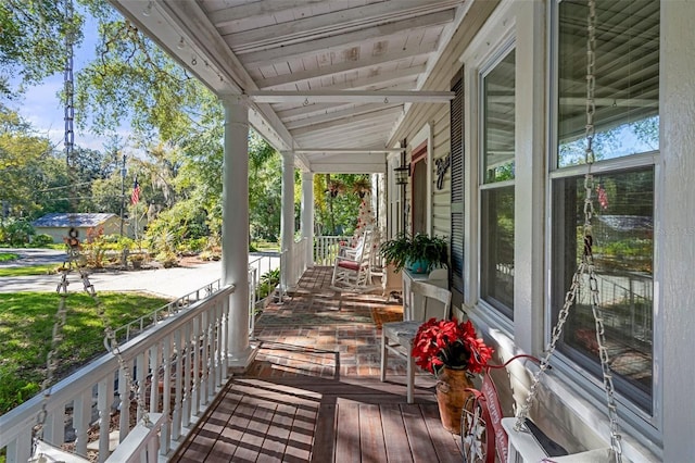 wooden deck featuring covered porch