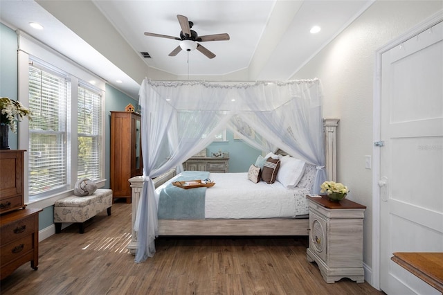 bedroom featuring dark hardwood / wood-style floors, multiple windows, and ceiling fan