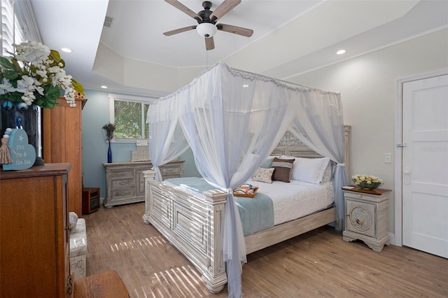 bedroom featuring hardwood / wood-style floors and ceiling fan