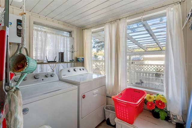 laundry area featuring washer and dryer and wooden ceiling