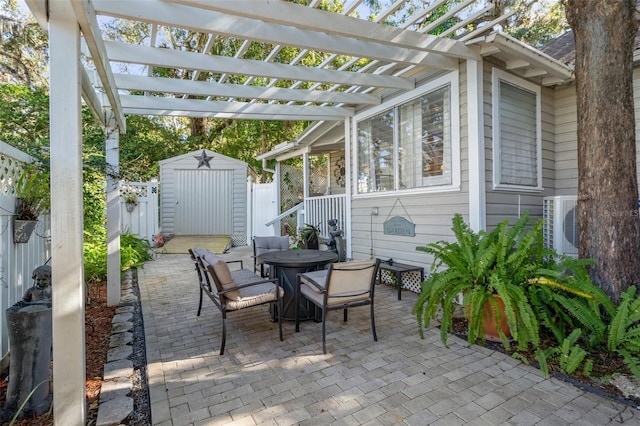 view of patio with a storage shed and a pergola