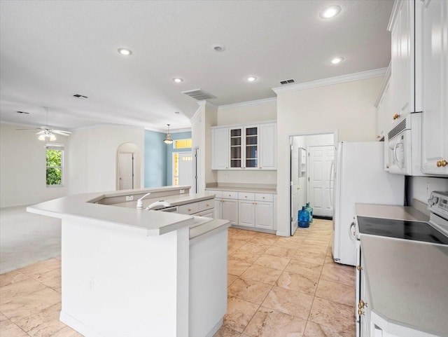 kitchen with electric range, crown molding, white cabinetry, and an island with sink