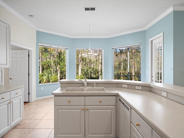 kitchen featuring dishwasher, ornamental molding, a healthy amount of sunlight, and sink