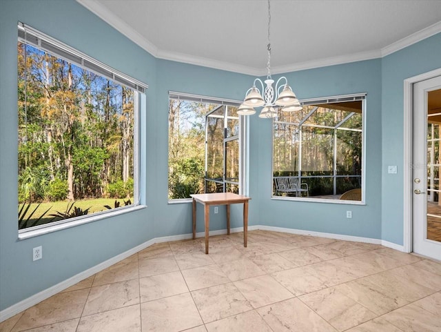 dining space featuring ornamental molding, a wealth of natural light, and a chandelier