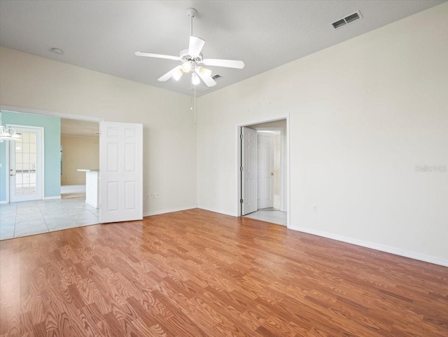 unfurnished room featuring ceiling fan and light hardwood / wood-style flooring