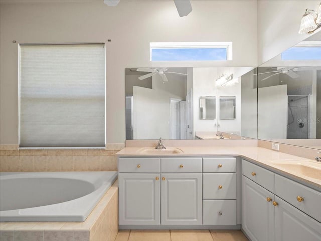 bathroom featuring vanity, tile patterned floors, and separate shower and tub