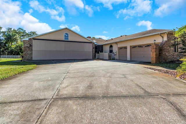 ranch-style house featuring a garage