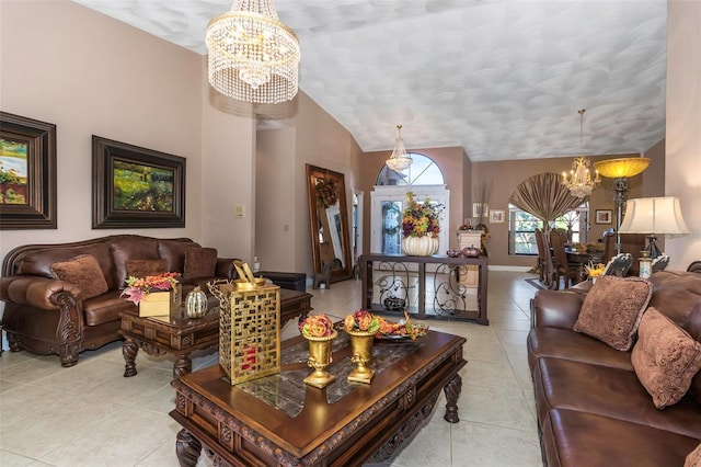 tiled living room featuring an inviting chandelier and vaulted ceiling