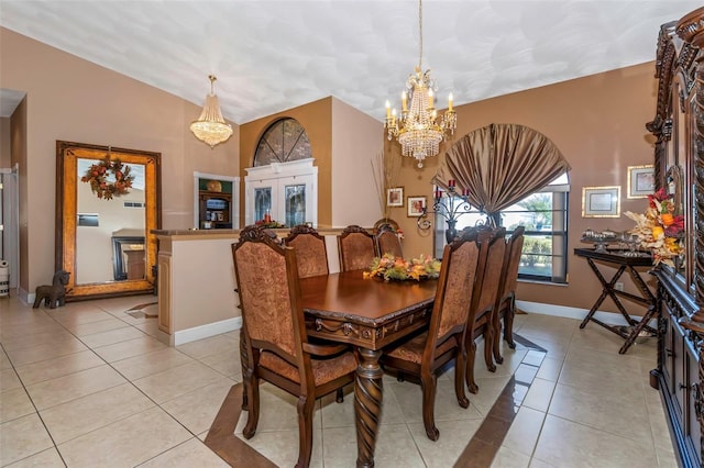 dining room with an inviting chandelier and light tile patterned flooring