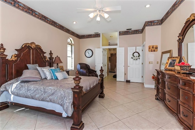 bedroom featuring light tile patterned floors and ceiling fan