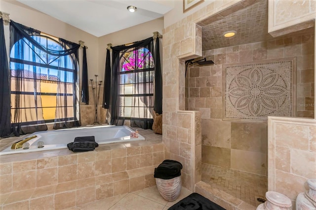 bathroom with separate shower and tub, tile patterned flooring, and tile walls