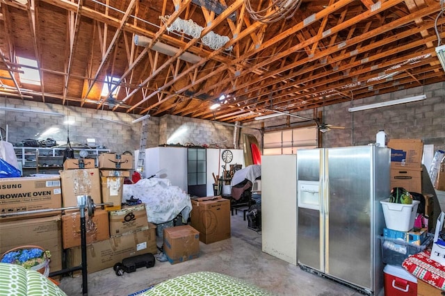 interior space with stainless steel fridge with ice dispenser and ceiling fan