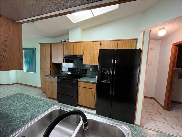 kitchen featuring black appliances, a textured ceiling, sink, and vaulted ceiling