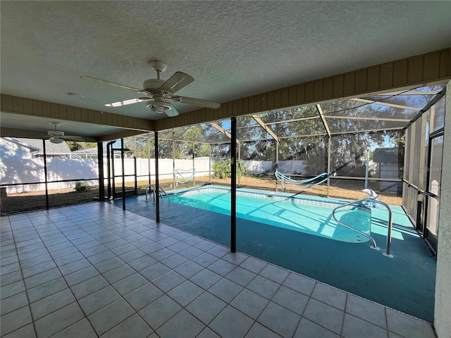 view of pool featuring a patio, a lanai, and ceiling fan