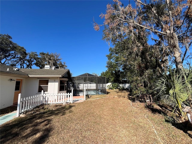 view of yard with a lanai and a patio