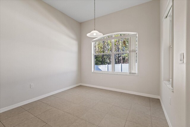 spare room with light tile patterned floors