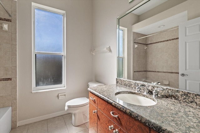 full bathroom with toilet, vanity, tile patterned floors, and tiled shower / bath